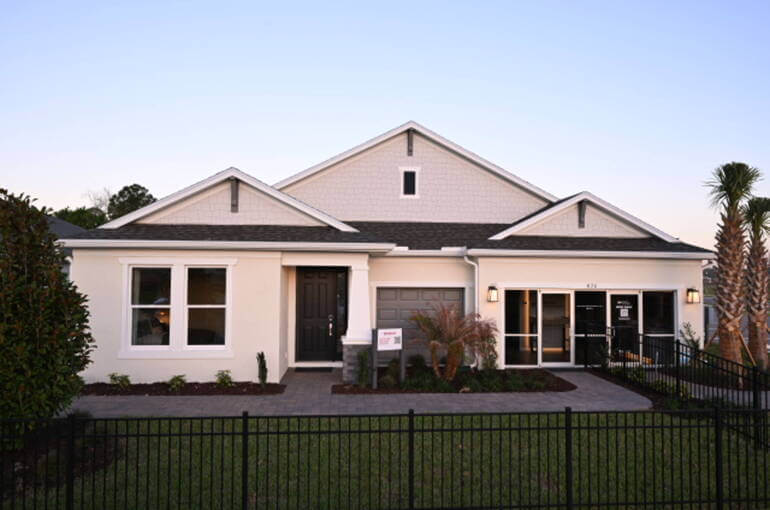 Image of a house with a distracting fence in the foreground removed