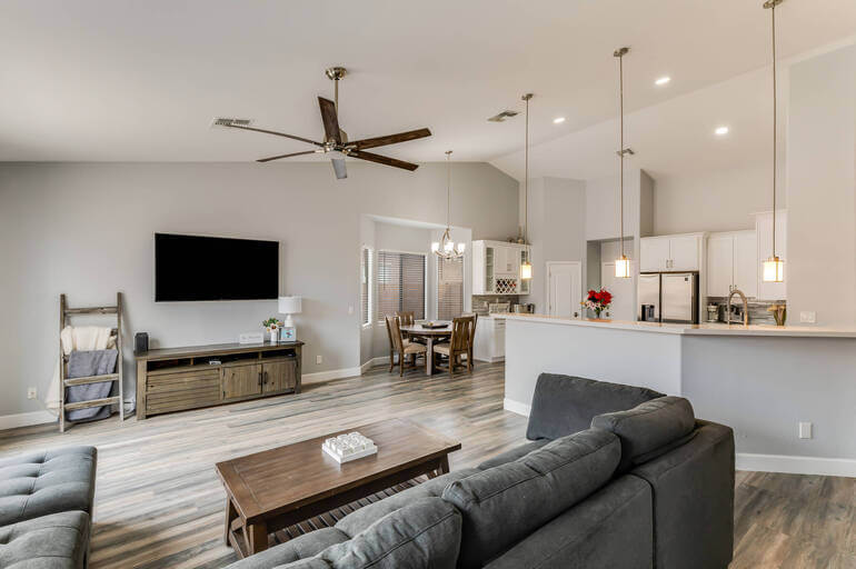 Living room with personal items (photos, awards) removed - real estate photo editing ai