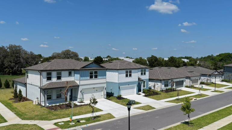 Exterior shot, street signs and power lines 