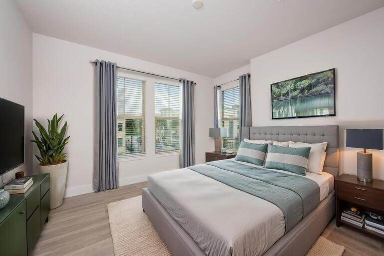 Before and after AI virtual staging of an empty bedroom transformed into a fully furnished, listing-ready space.