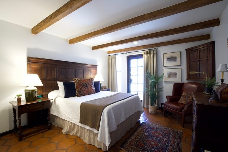 Before and after comparison of a bedroom interior demonstrating AI real estate photo editing.