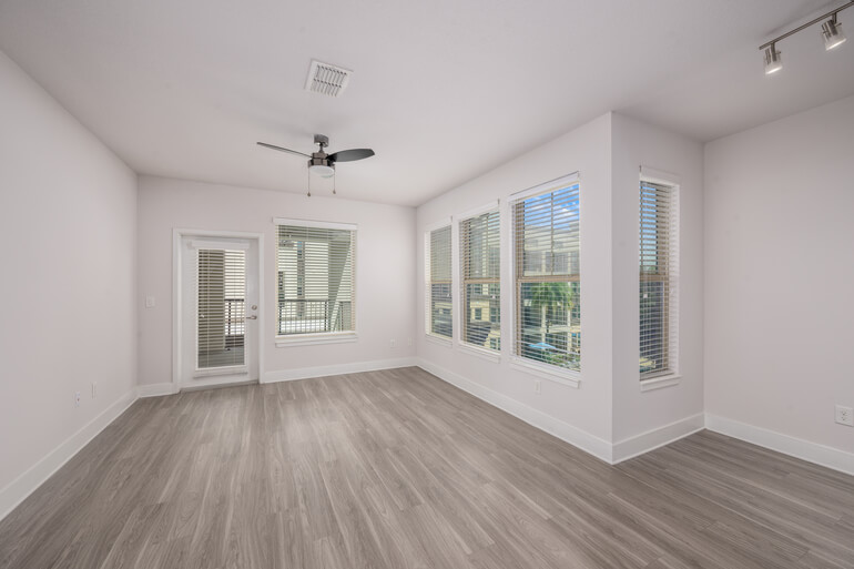 Real estate AI virtual staging before and after comparison of a living room.