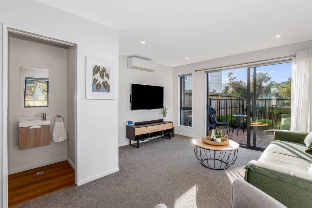 AI photo editing for real estate enhances a modern living room.