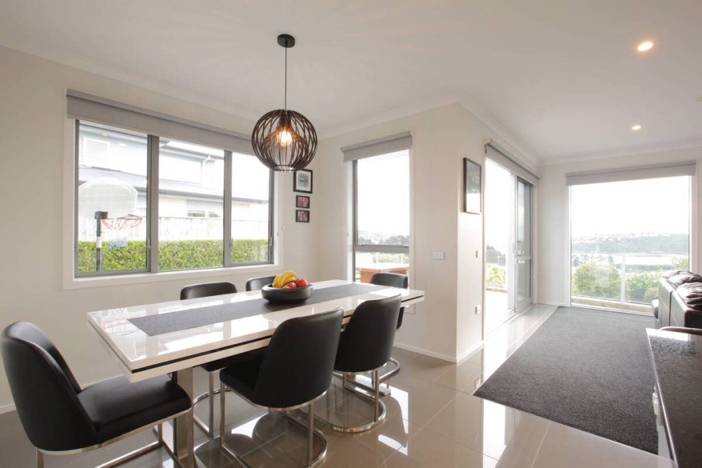 Dining room before AI photo editing for real estate.