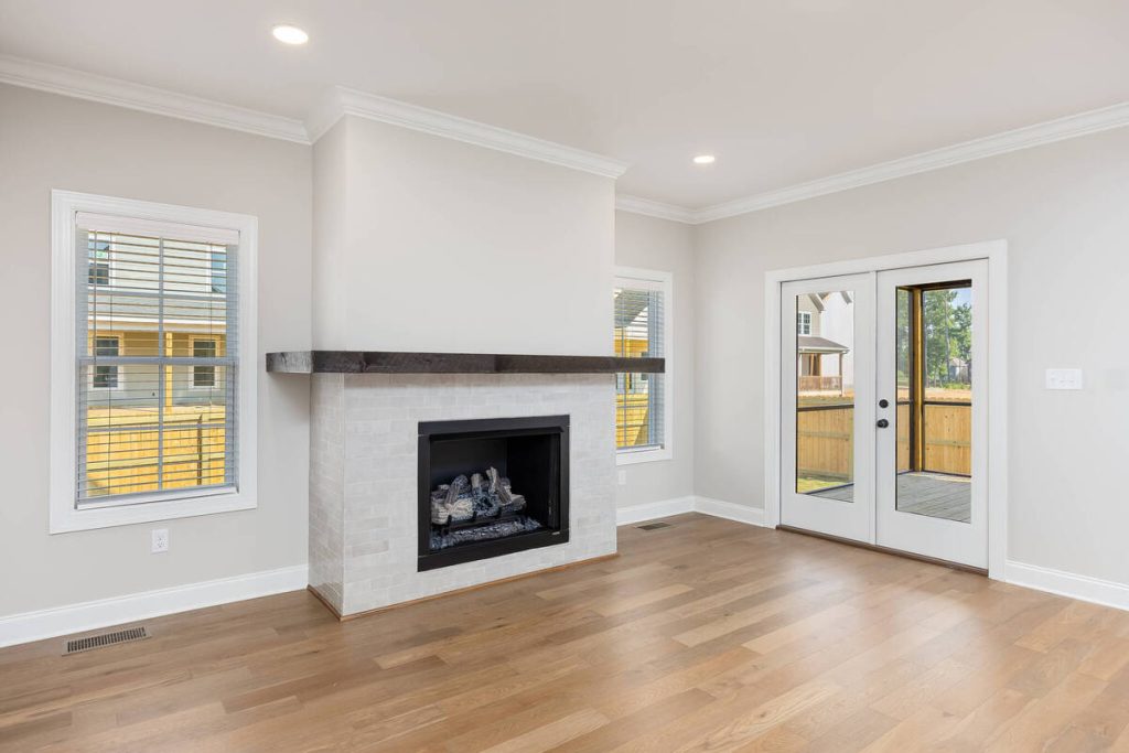 AI photo editing for real estate enhances an empty living room.