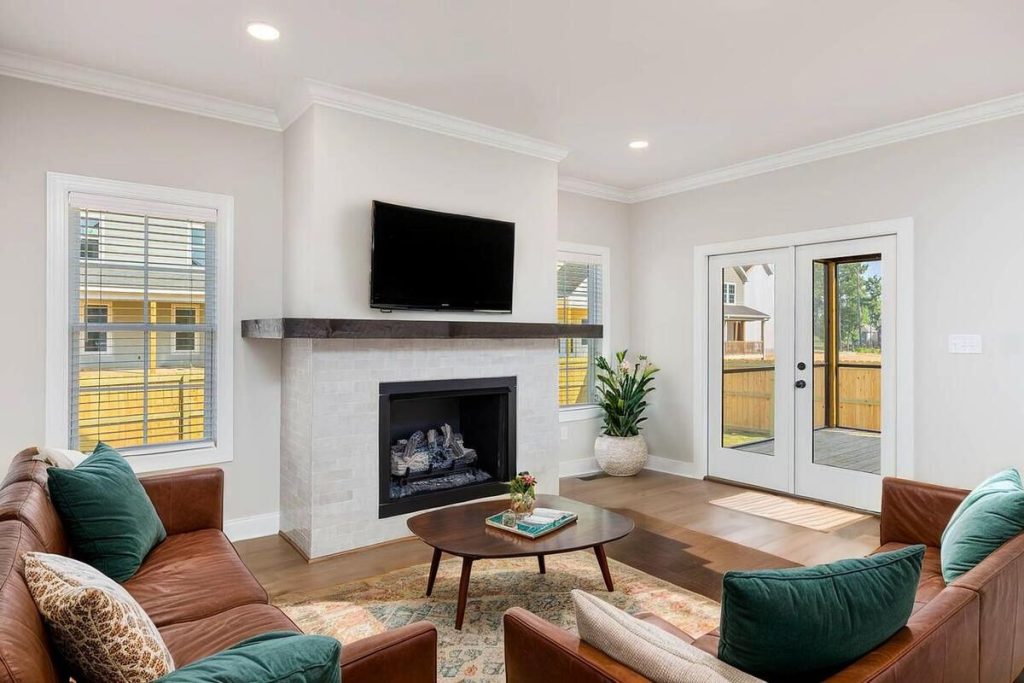 Contemporary living room staged with leather seating and elegant décor.
