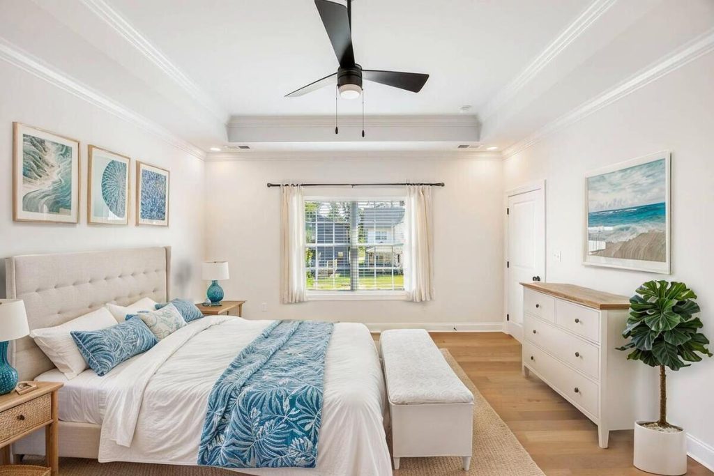 AI-staged coastal bedroom with white furniture and blue décor.