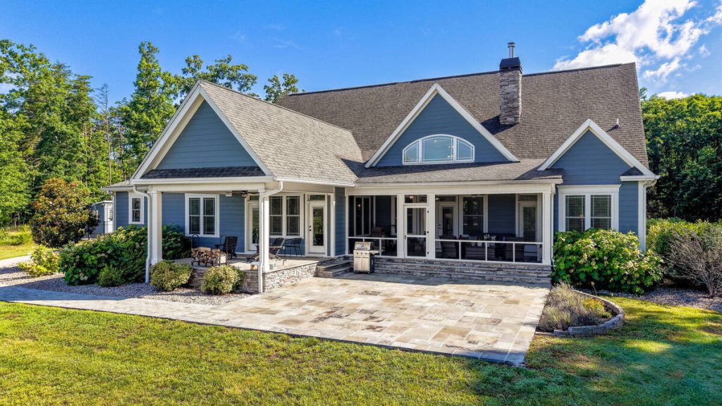 Blue luxury home rear exterior edited for real estate listing