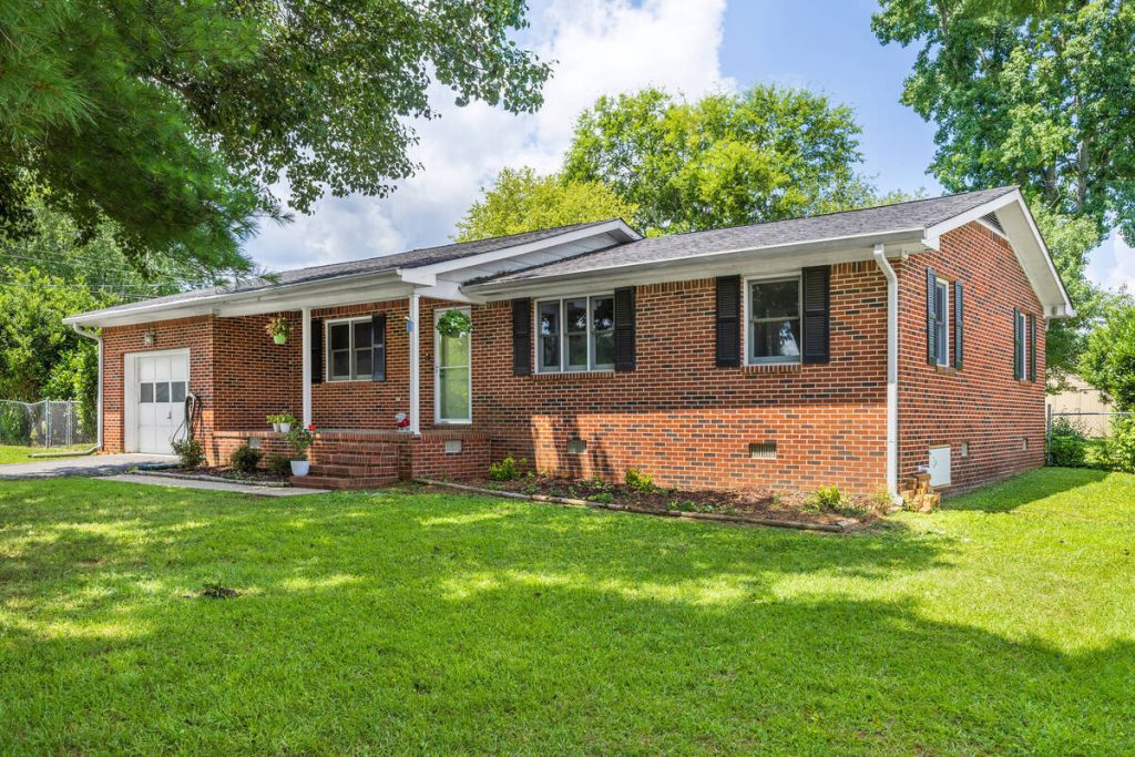 Brick home enhanced with photo editing for real estate agents