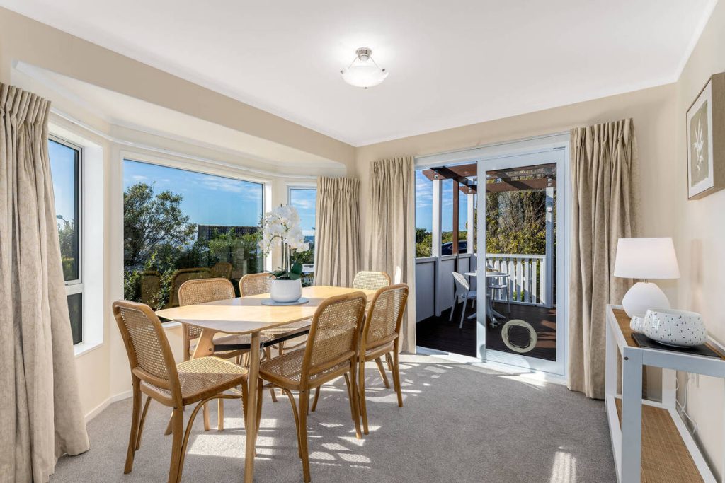 Dining room enhanced with real estate photo editing AI for brighter, balanced lighting.