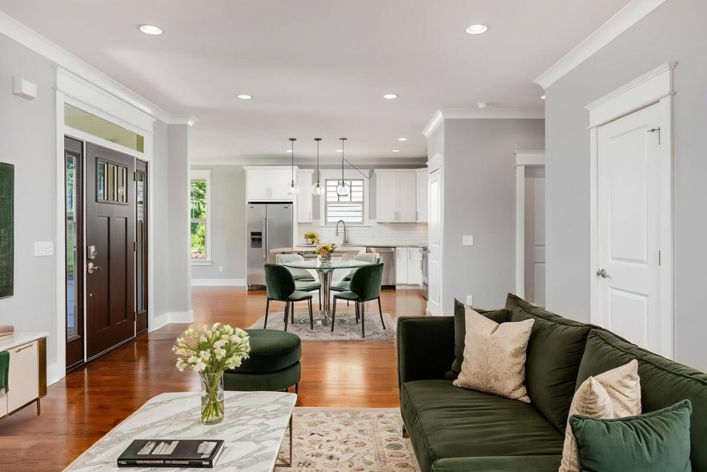 Luxury green-themed living room created with real estate photo editing AI.