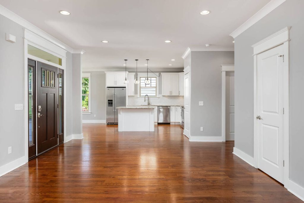 Empty open-concept living room ready for virtual staging with real estate photo editing AI.