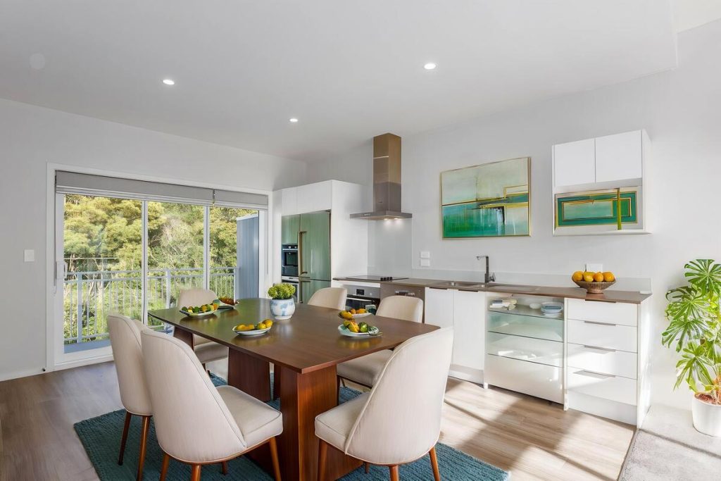 Best AI virtual staging example featuring a rustic wood table and metal dining chairs.