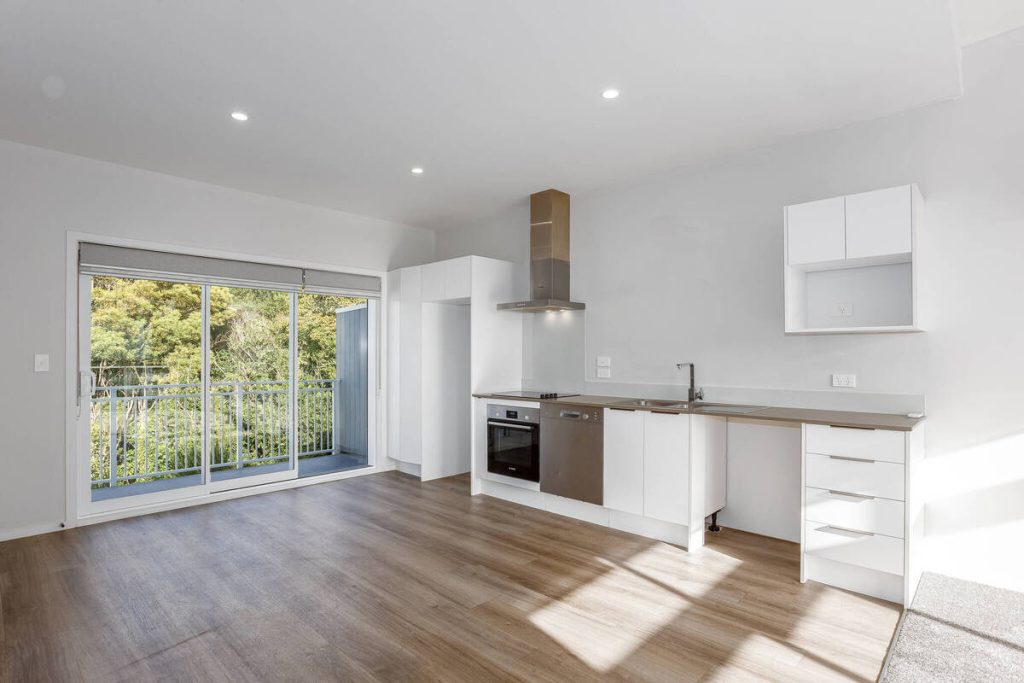 Empty kitchen and dining area before applying the best AI virtual staging.