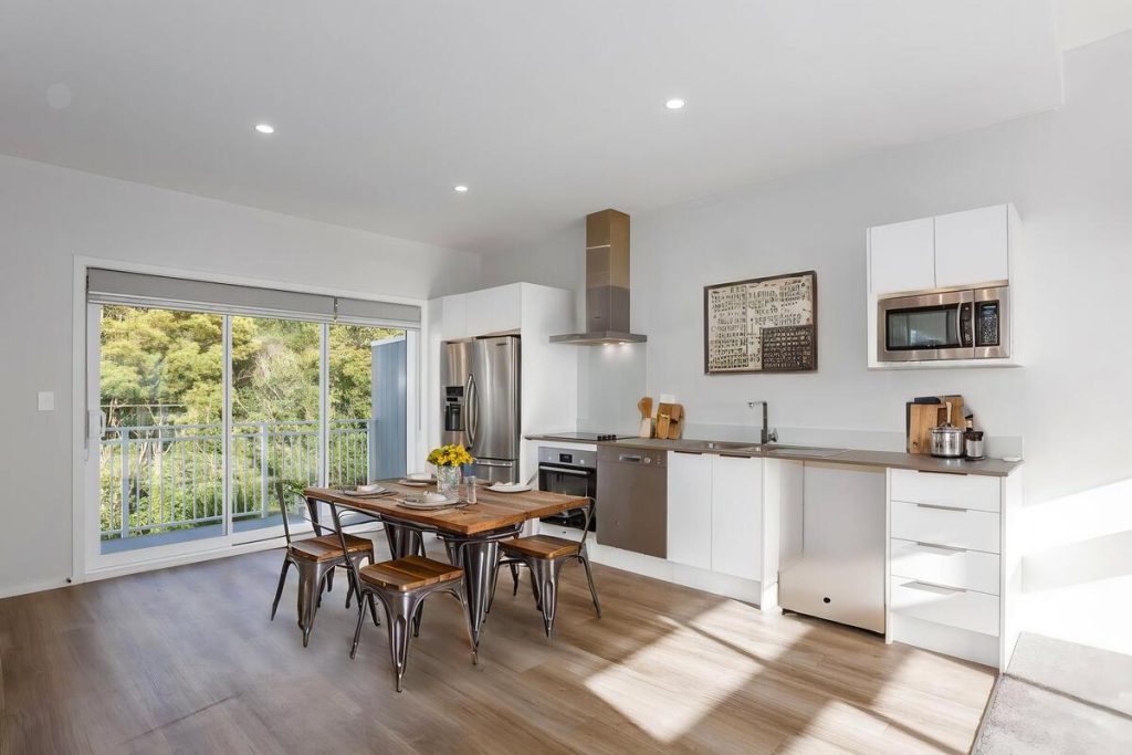 Best AI virtual staging example of a compact dining area with industrial-style furniture.