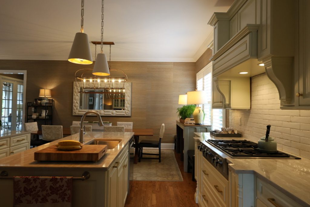 Kitchen before AI real estate photo editing color correction with warm, uneven lighting.