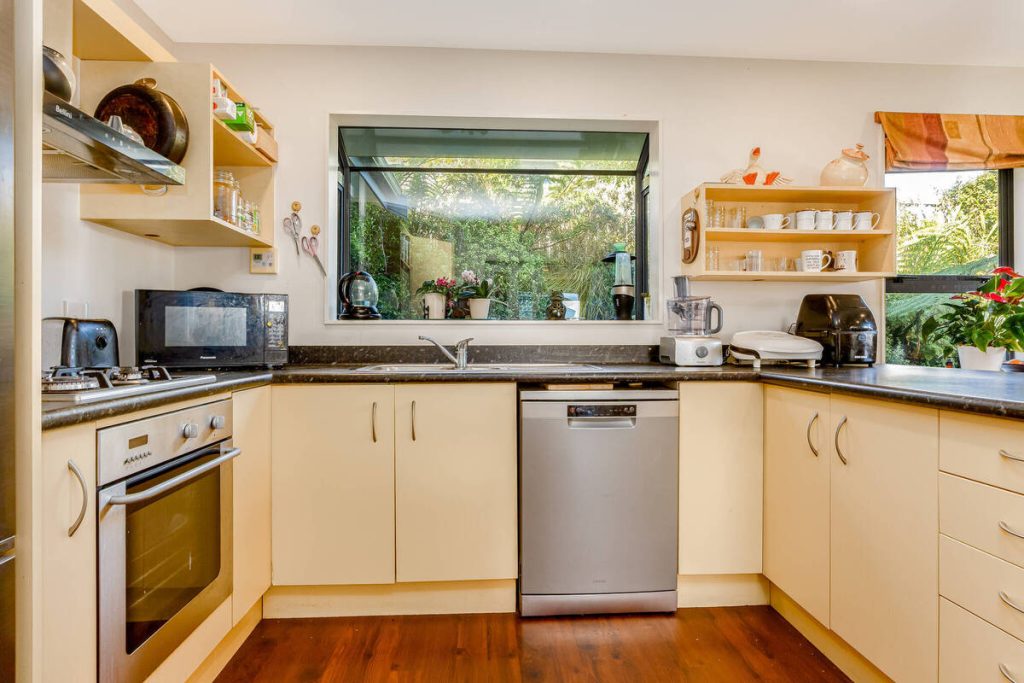 Kitchen after AI real estate photo editing removal for a cleaner presentation.