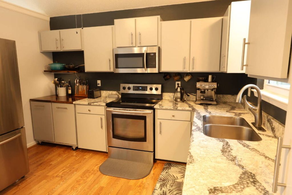 Kitchen before AI real estate photo editing straight lines and perspective correction.