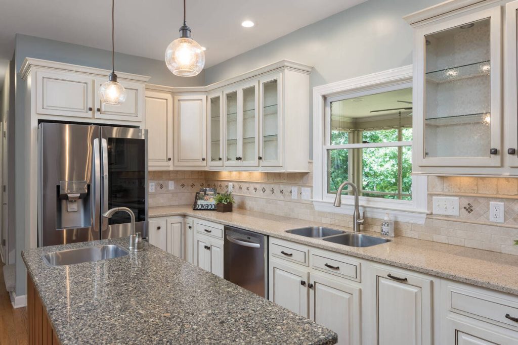 AI real estate photo editing highlighting clean countertops, cabinetry, and balanced interior lighting.
