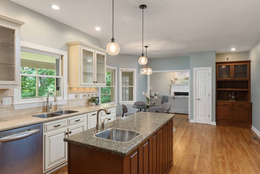 AI real estate photo editing showcasing an open kitchen with natural colors and clear interior details.