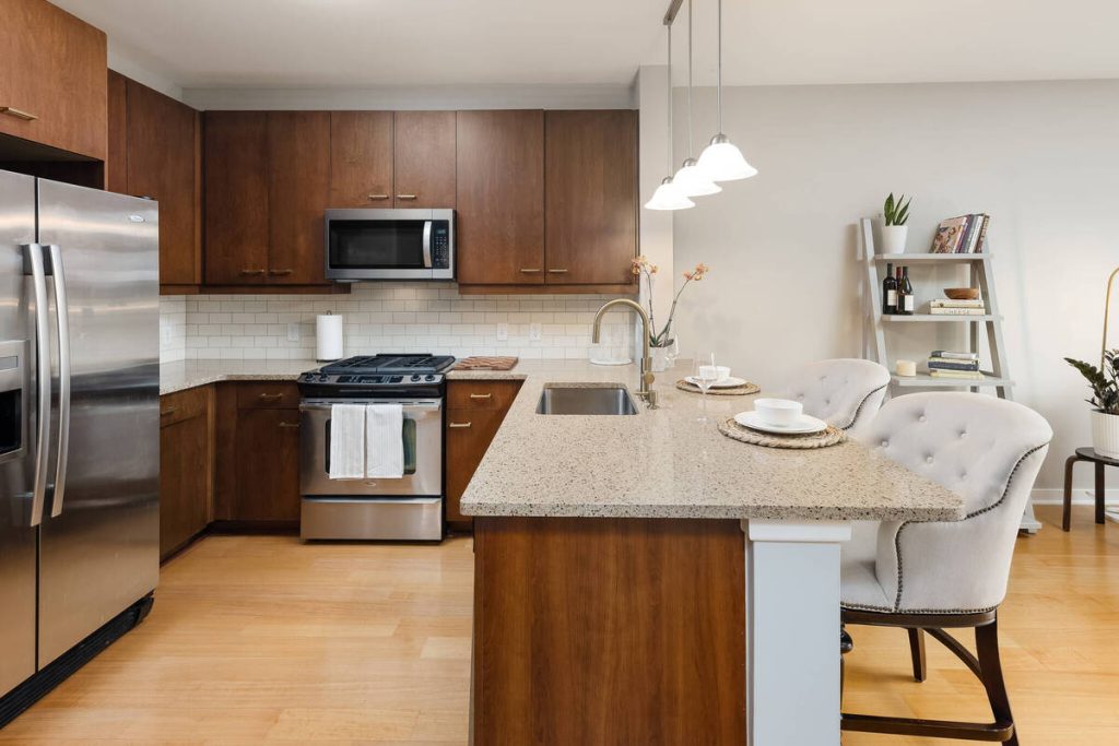 AI real estate photo editing with balanced lighting and natural colors in a modern kitchen.
