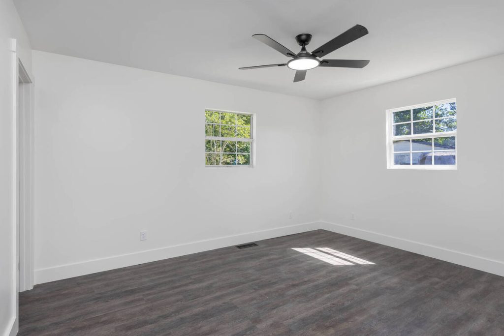 Empty coastal bedroom before using the best AI virtual staging for real estate