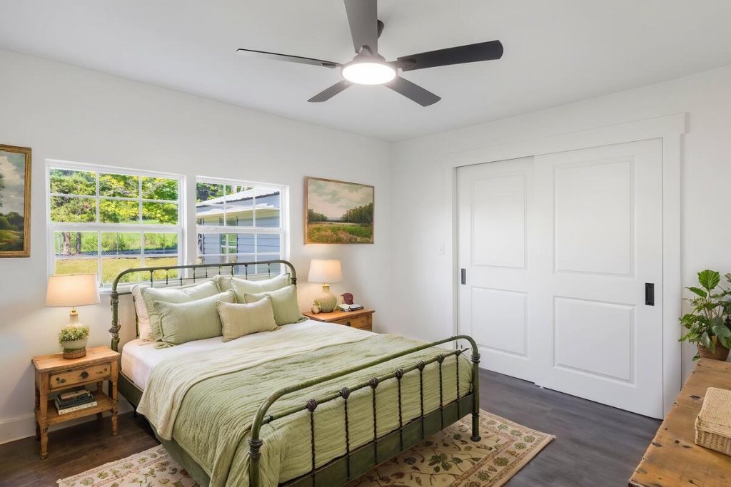 Rustic bedroom with metal bed styled using the best AI virtual staging for real estate