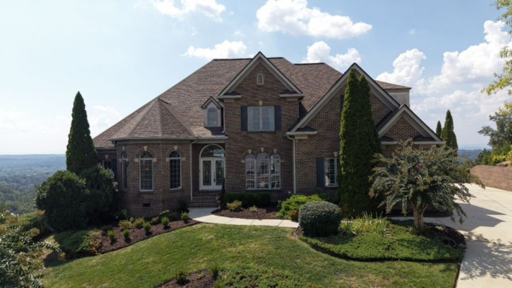 Real estate photo editor before editing a dark home exterior photo