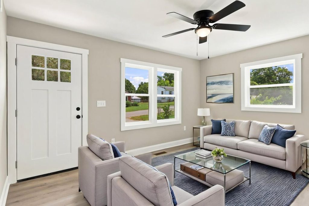 Real estate photo editor transforming an empty room with virtual staging