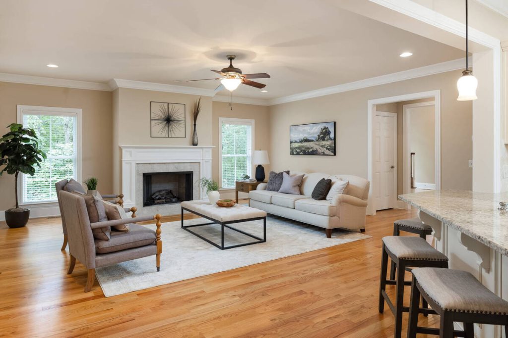 Real estate photo editor enhancing the lighting and color of a living room