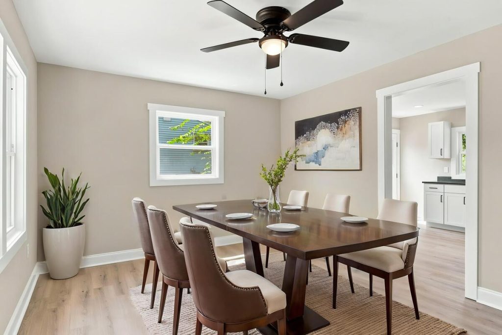 Real estate photo editor transforming an empty dining room with virtual staging