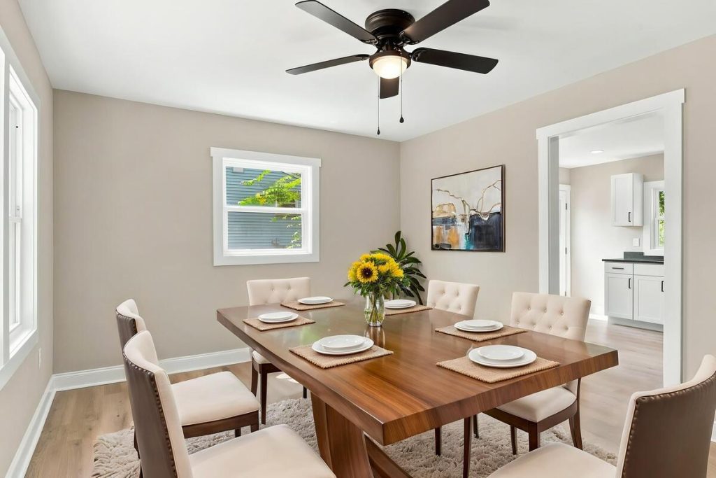 Real estate photo editor creating virtual staging for a dining room