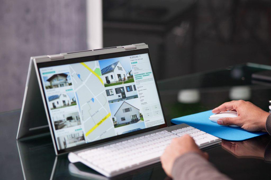 Real estate image editing workflow displayed on a computer during property photo review