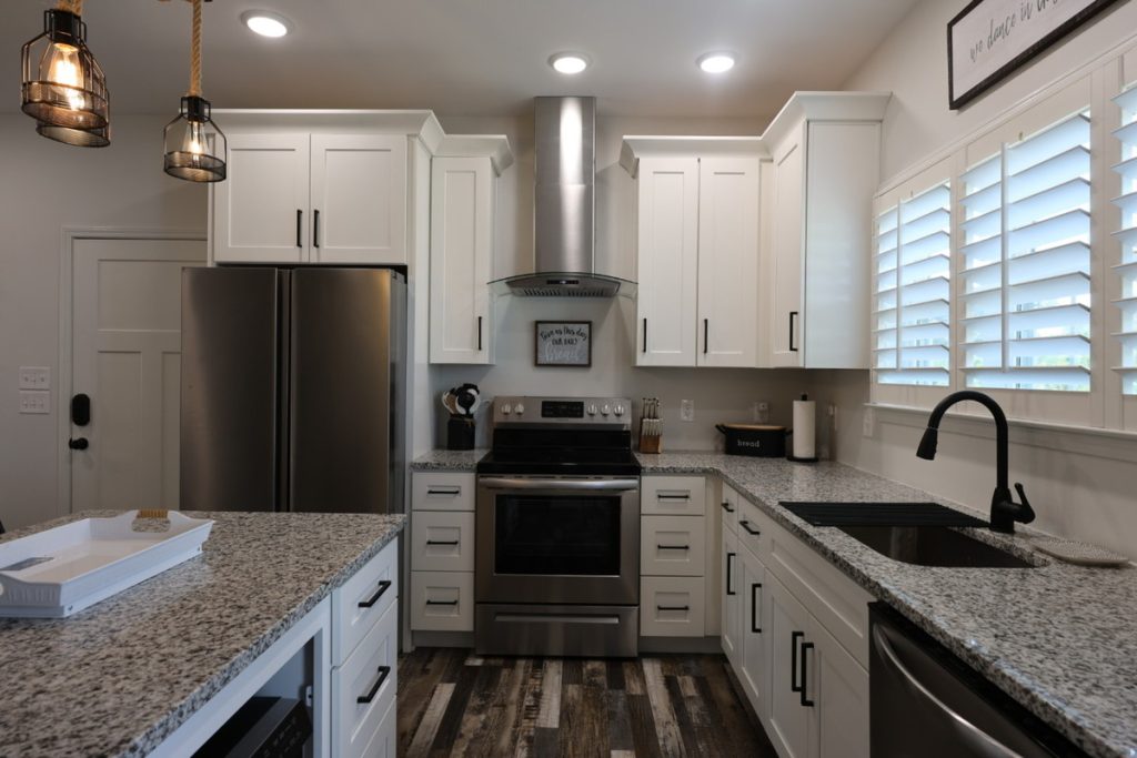 Real estate image editing example showing a darker kitchen before enhancement
