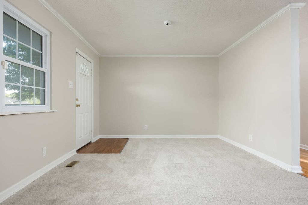 Empty living room ready for furniture placement with virtual staging software.