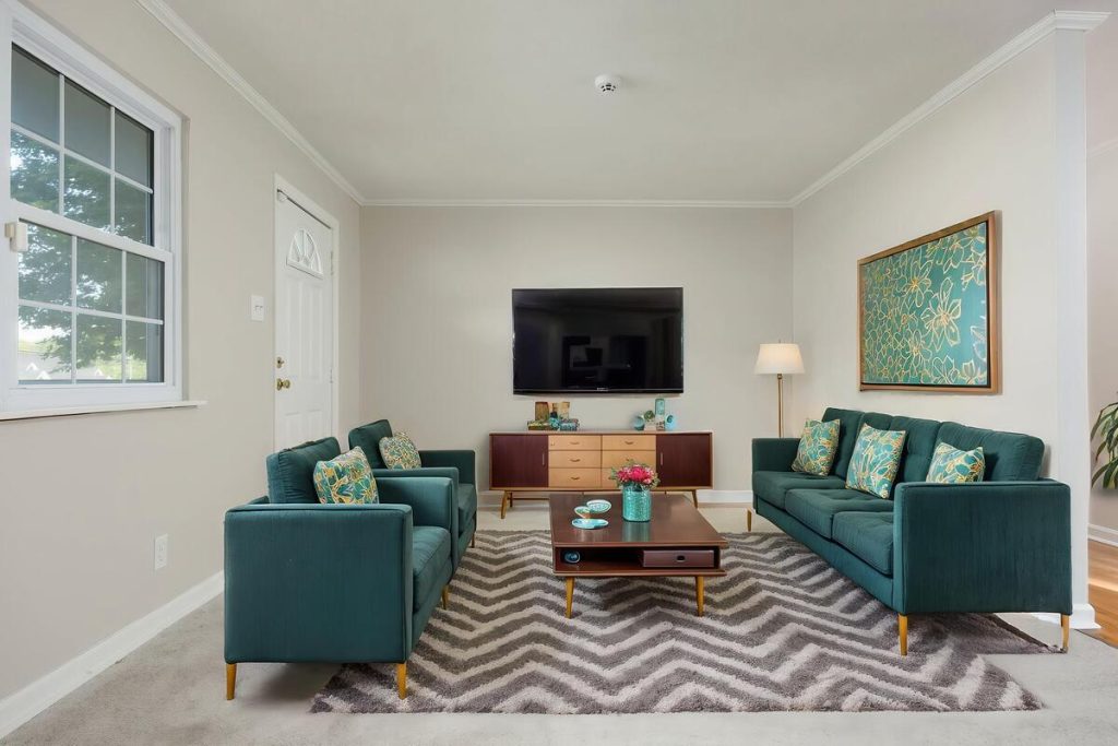 Teal furniture arrangement showing a different living room style from virtual staging software.