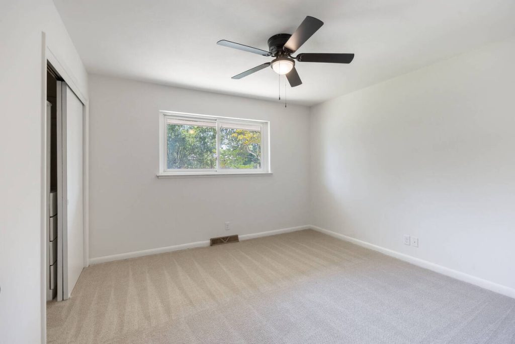 Empty bedroom before adding furniture with virtual staging software.