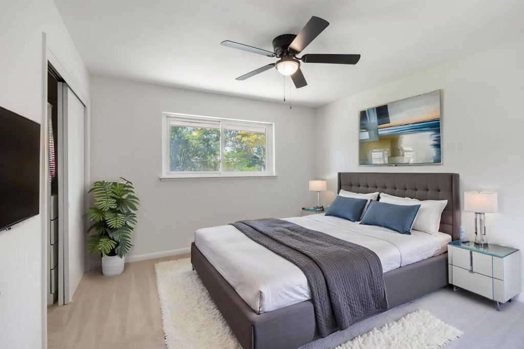 Virtually staged bedroom showing an alternative furniture layout with virtual staging software.