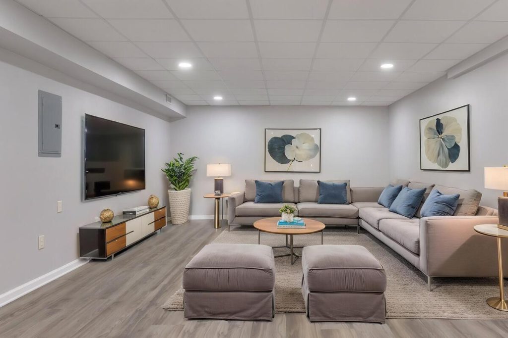 Finished living room with sectional sofa and TV created using virtual staging software.