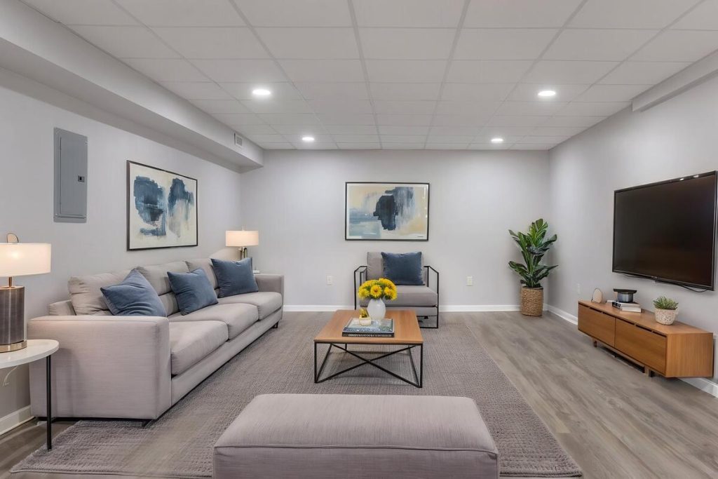 Spacious living area with sectional seating using virtual staging software.